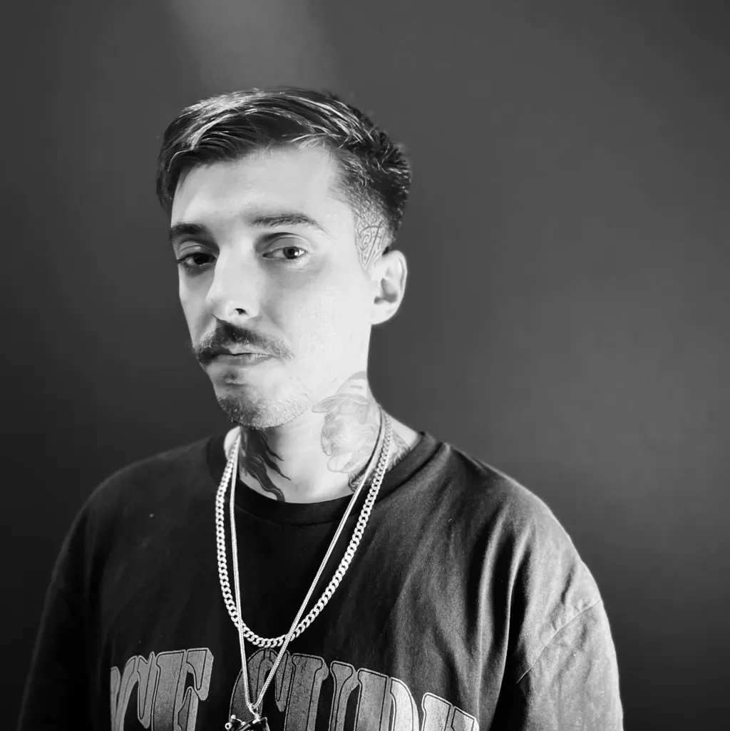 Portrait of Kaue Ochoski, tattoo artist at Arrels Tattoo