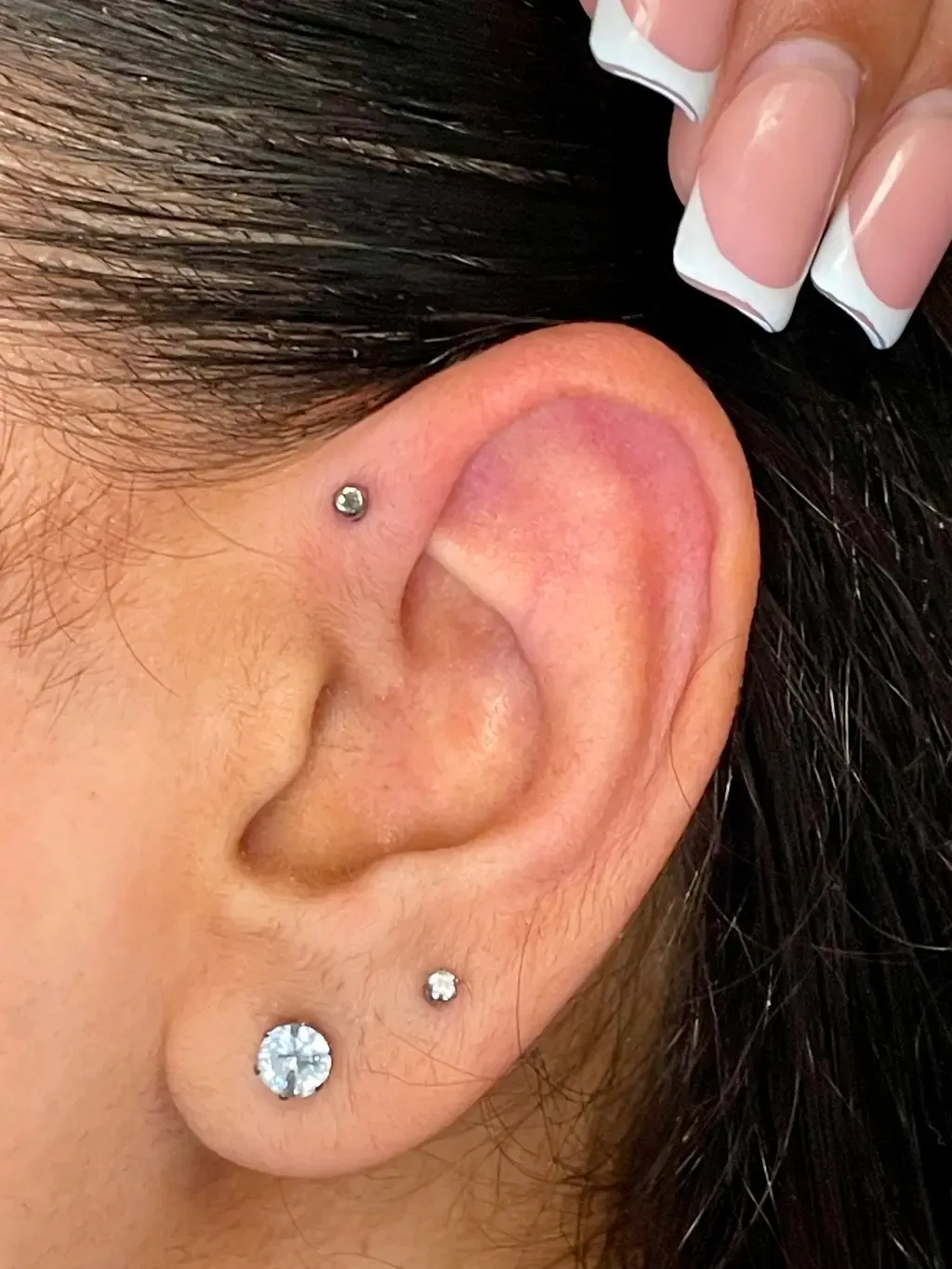 Antihelix and Lobe, piercing work performed by Ramiro at Arrels Tattoo