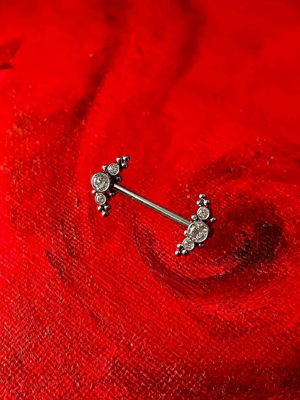 Nipple Jewellery with Crystals, piercing work performed by Ramiro at Arrels Tattoo