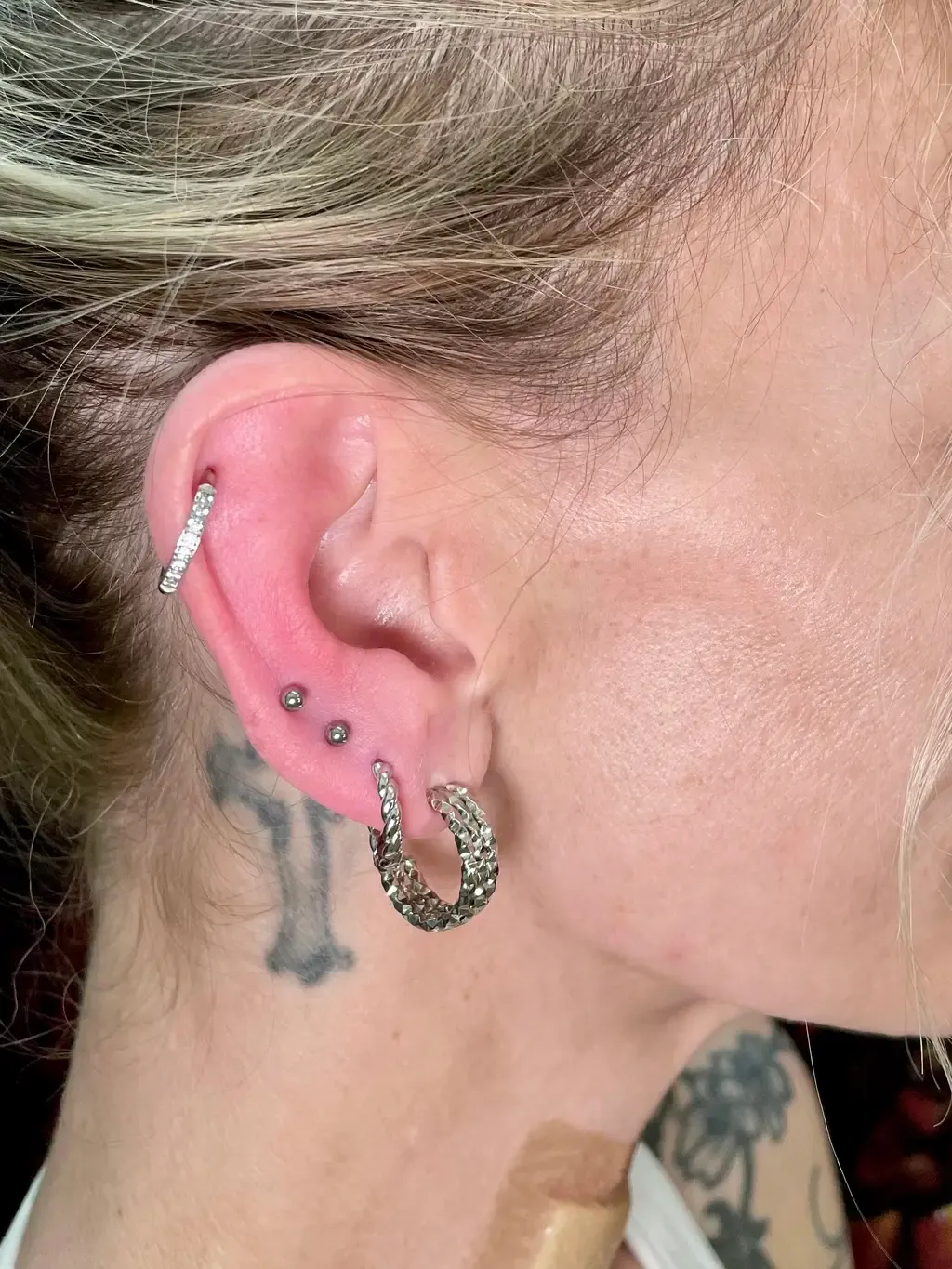 Helix and Four Lobes, piercing work performed by Ramiro at Arrels Tattoo
