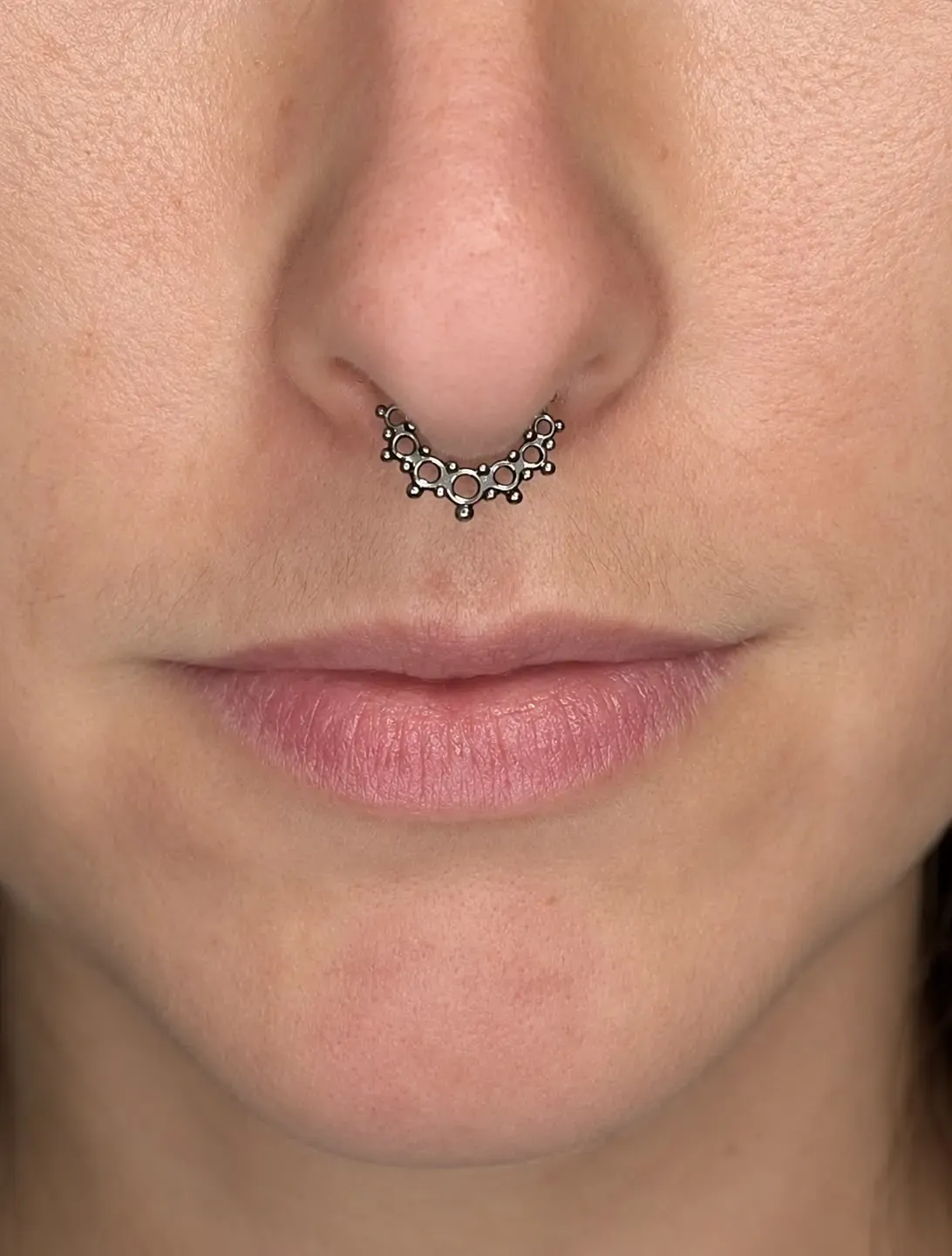 Titanium Septum, piercing work performed by Ramiro at Arrels Tattoo