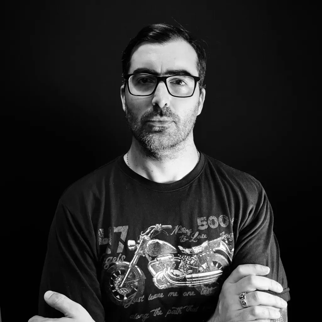 Portrait of Ramiro Miret, Fine Line tattoo artist and piercer at Arrels Tattoo
