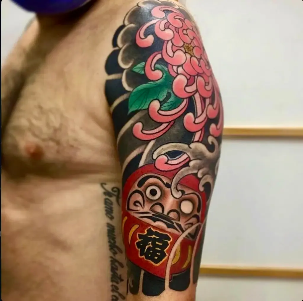 Daruma and Chrysanthemum, tattoo by Mariano “El Tata”